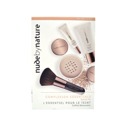 Nude by Nature complexion essentials kit packaging with makeup items on a white background