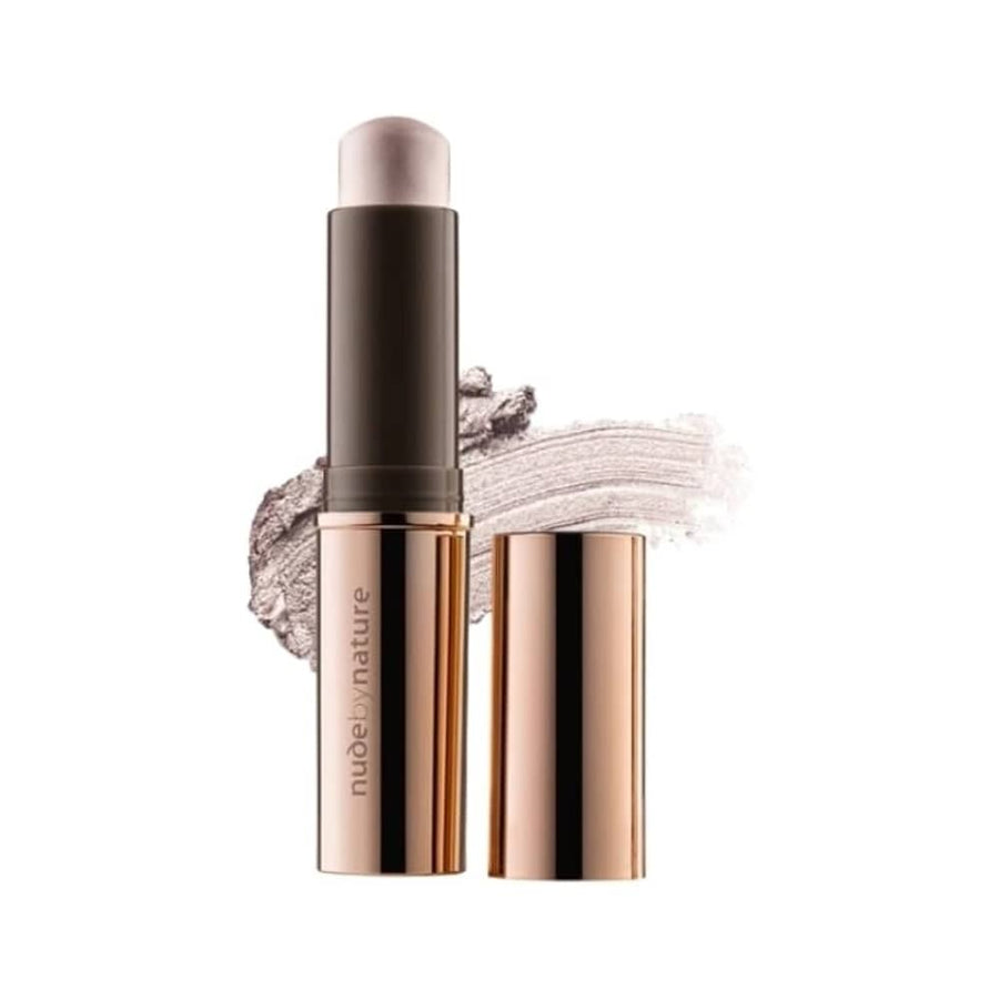 Makeup stick with applicator and swatch on a white background