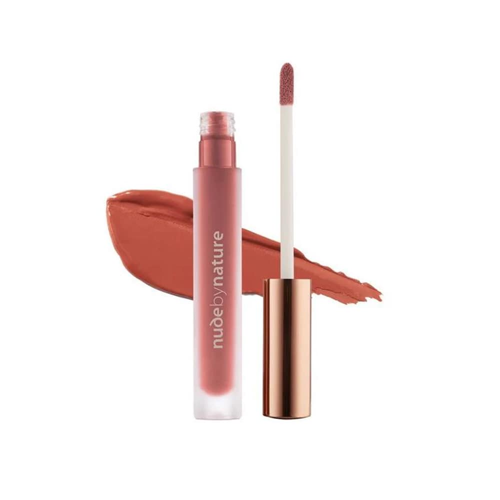 Lipstick with applicator and swatch on a white background, featuring the brand 'nude by nature'.