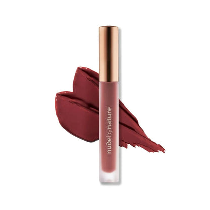 Lip gloss with a swatch of color on a white background, featuring the brand 'nude by nature'.