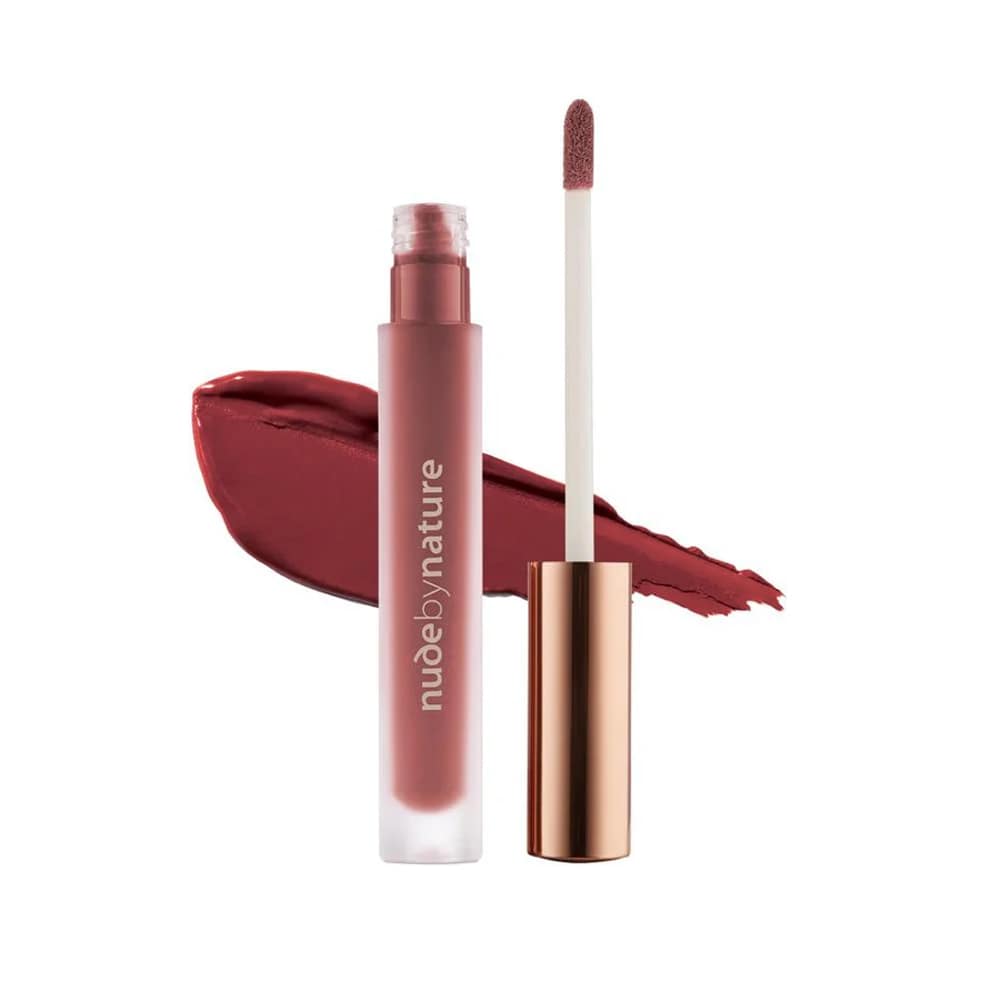 Lipstick with applicator and swatch on a white background, featuring the brand 'nude by nature'.