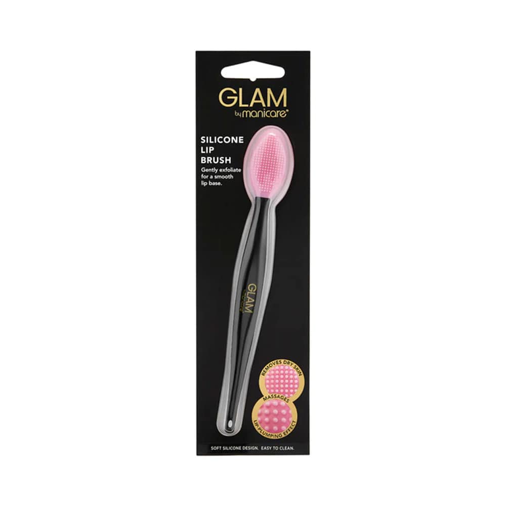 A silicone lip brush with pink bristles, packaged in a black card with the 'Glam By Manicare' branding.