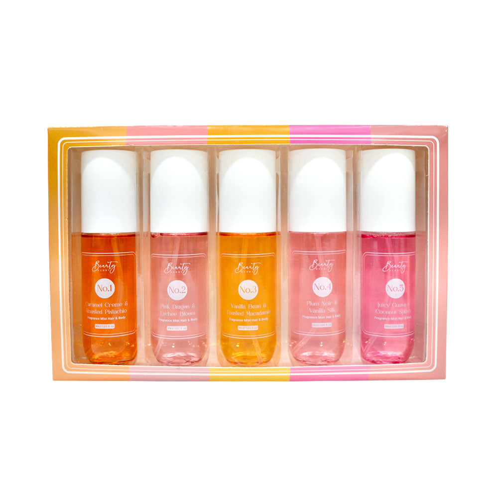 Set of five beauty buddy body mist bottles in a decorative box on a white background