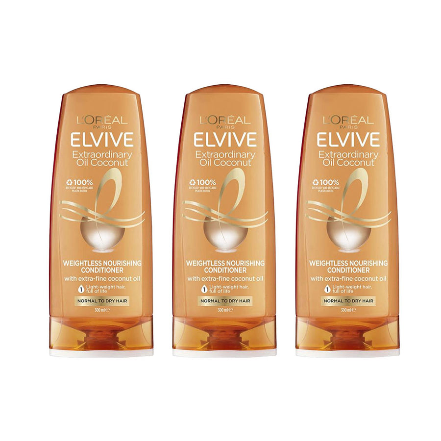 Three bottles of L'Oreal Elvive Extraordinary Oil Coconut conditioner on a white background