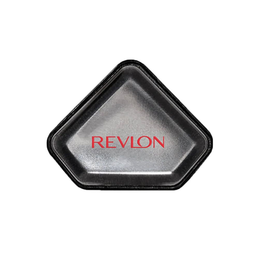 A triangular-shaped, dual-sided Revlon applicator sponge with the brand name visible.