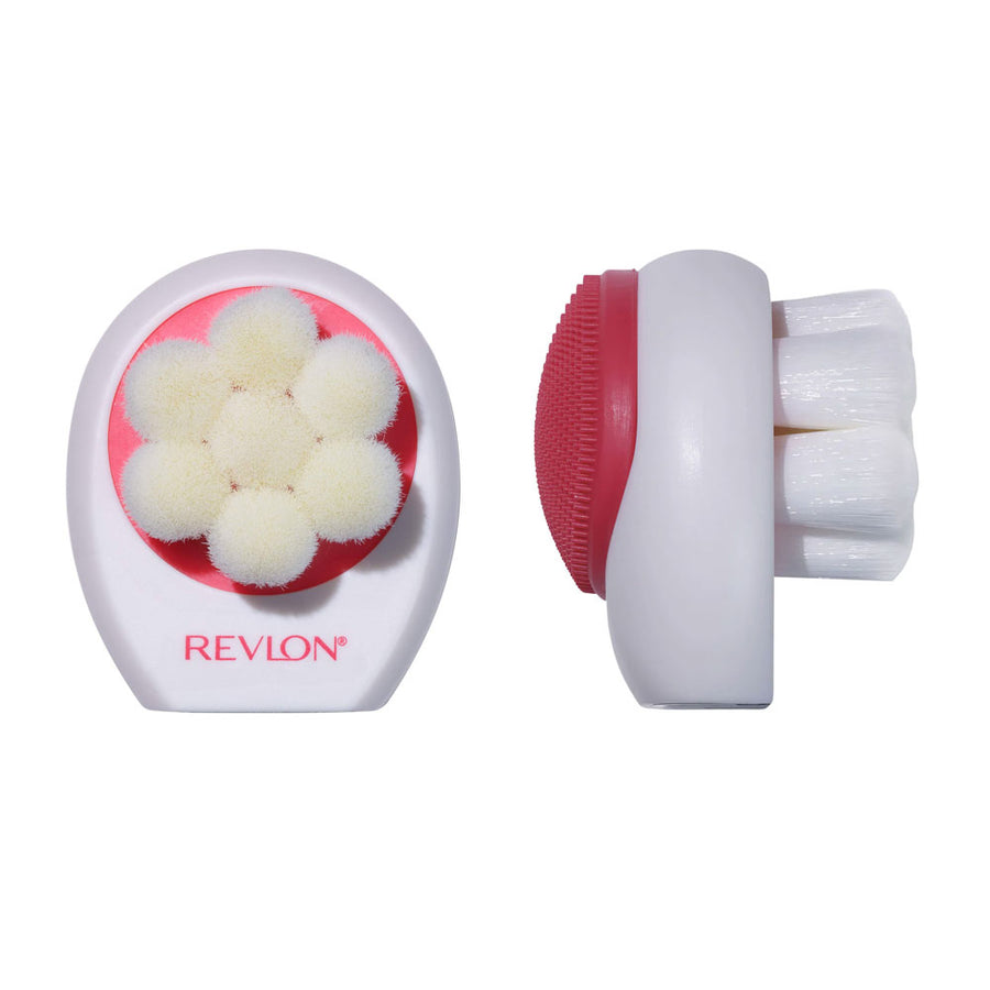 A double-sided Revlon cleansing brush with soft silicone bristles on one side and exfoliating bristles on the other, in white and red color.
