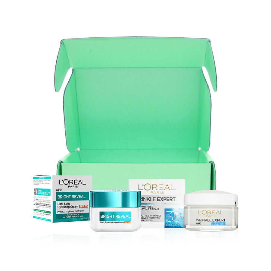 L'Oreal skincare products including cream jars and boxes on a white background